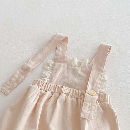 Romper crema con flor tejida