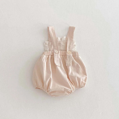 Romper crema con flor tejida