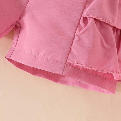 Set de lazo con perlas en pantalón corto y gorro.